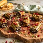 Auberginenröllchen mit Blumenkohl-Couscous und Granatapfel, bestreut mit BIO ANTIPASTI FOOD FINISHER nach Rezept